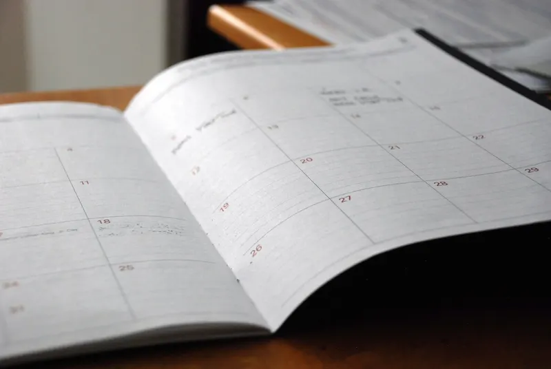 An open monthly planner on a desk